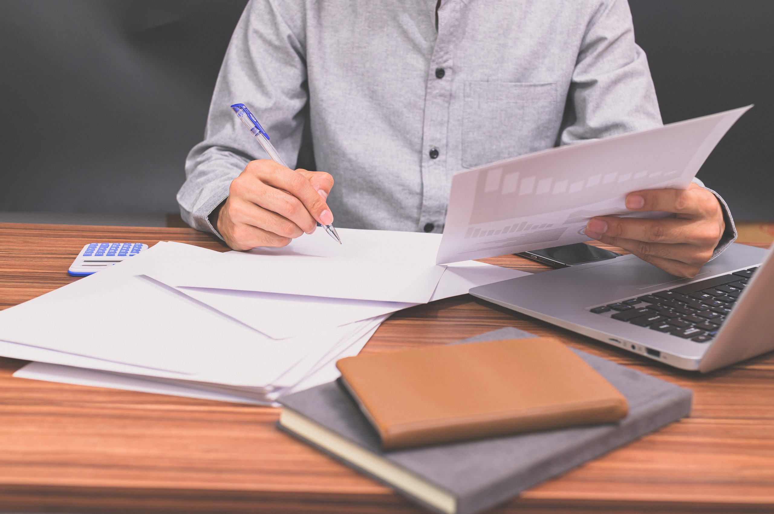 Business people sit at work and check documents At the desk in the room