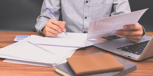Business people sit at work and check documents At the desk in the room